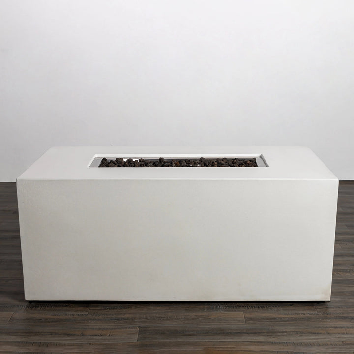 A side view of the Starfire Designs Beton 55" White Rectangle Hidden Propane Tank Gas Fire Pit displaying its clean lines and smooth rectangular design. The fire pit’s sleek white finish adds a modern touch, with visible lava rock filling the burner area for a natural and rustic contrast.