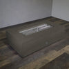 A top view of the Starfire Designs Concrete Rustic 60" x 32" Rectangle Gravity Gas Fire Pit in brown, showing the unlit stainless steel burner in the center of the smooth concrete surface. This modern gas fire pit is perfect for outdoor spaces, made from durable, weather-resistant materials for long-lasting use. The rectangular design enhances both form and function, offering a sleek addition to any backyard or patio setting