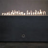 Close-up of the flames from the Starfire Designs Concrete Rustic 60" x 32" Rectangle Gravity Gas Fire Pit in Graphite, highlighting the even flame distribution and stainless steel burner system. This fire pit delivers a mesmerizing flame display, perfect for creating an inviting outdoor atmosphere