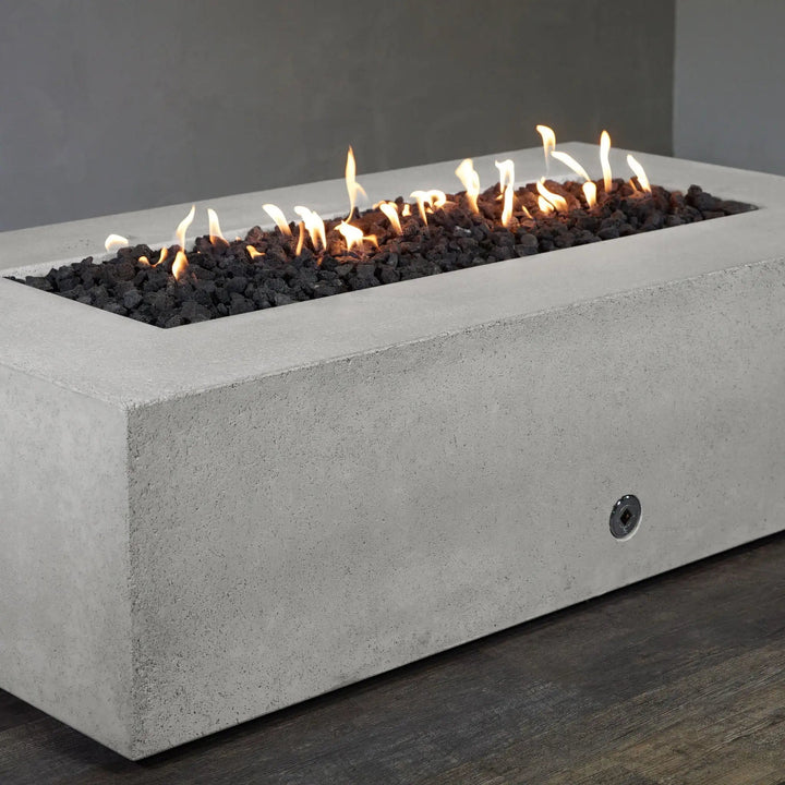 A detailed corner shot of the white Starfire Designs Concrete Rustic 72" x 38" Rectangle Gravity Gas Fire Pit, showing its clean edges and durable construction, ideal for contemporary outdoor spaces. Keywords: white corner view, concrete fire pit, modern gas fire pit, Starfire Designs, outdoor heating, rustic fire pit, durable design
