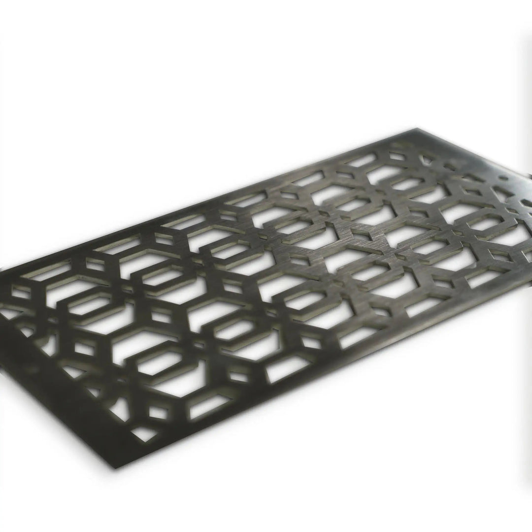 Angled view of the Starfire Designs Decorative Fire Pit Venting Panel - Arbor, highlighting the durable stainless steel construction and decorative pattern. Perfect for enhancing the safety and aesthetics of modern outdoor fire pits