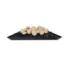 A tray filled with 24 beige fire pebbles arranged neatly on a bed of black fire glass, creating a striking contrast. These ceramic fire pebbles are designed for use in outdoor fire pits, adding a natural and elegant look to the fire feature. The smooth surface and uniform shape of the pebbles make them perfect for modern fire pit designs
