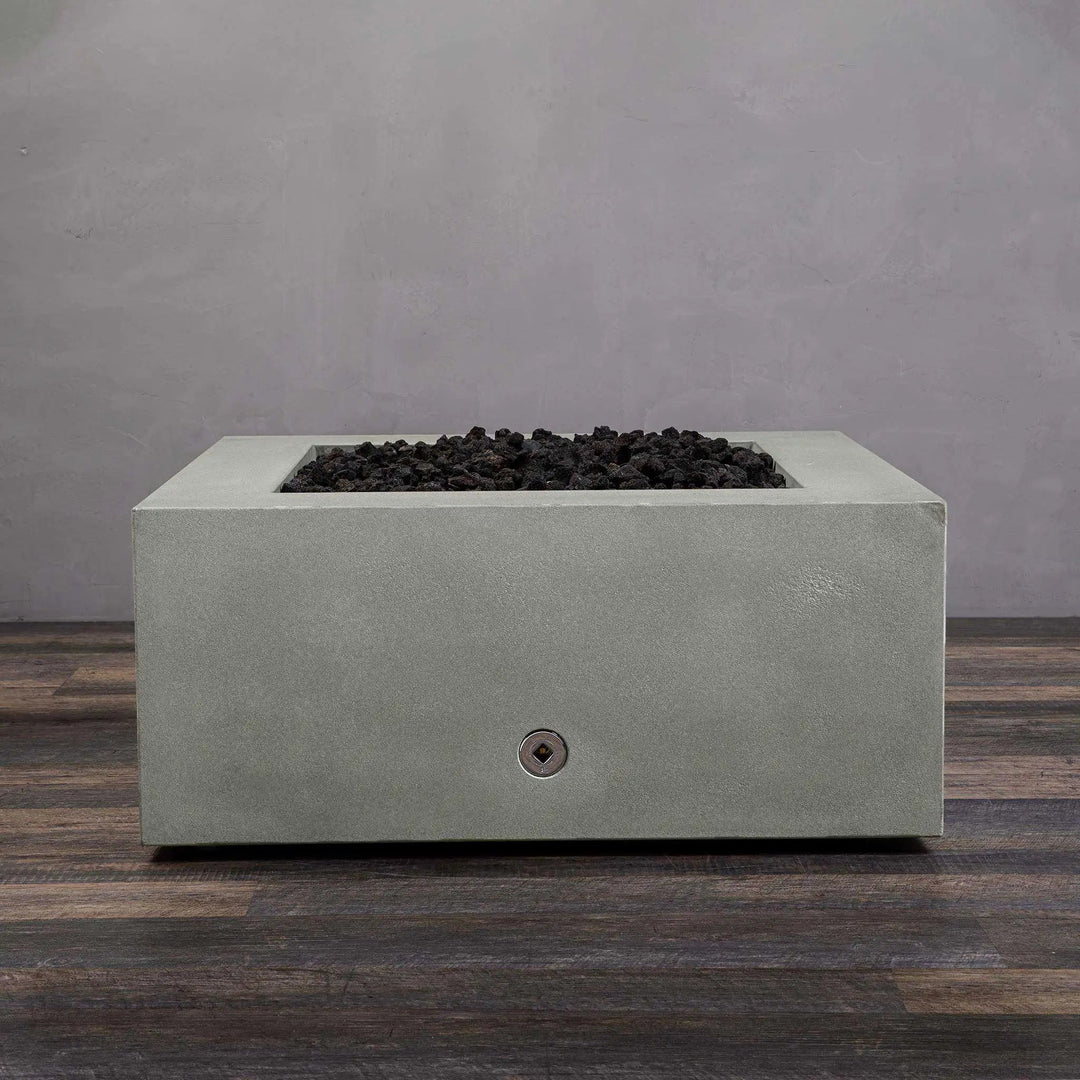 Top-down view of the Starfire Designs Gravity 36-inch Square Concrete Gas Fire Pit in natural gray with black lava rocks, showcasing the sleek square design and high-quality construction, perfect for any modern patio or backyard setup