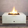 Starfire Designs Gravity 45-inch Square Concrete Gas Fire Pit in white, showcasing a large flame with lava rocks inside the fire bowl, perfect for outdoor patios. Durable and modern in design, this fire pit is ideal for contemporary outdoor spaces. Gas-powered for easy use, providing warmth and ambiance