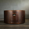 Back view of the Gravity Moreno 45-inch round copper fire pit by Starfire Designs, showcasing the propane tank access door with an intricate copper finish, highlighting the functional design and craftsmanship of the fire pit