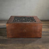 Front view of the Starfire Designs Moreno 36-inch square copper fire pit, unlit, showcasing the detailed hammered copper surface and deep fire bowl, perfect for enhancing contemporary outdoor living spaces