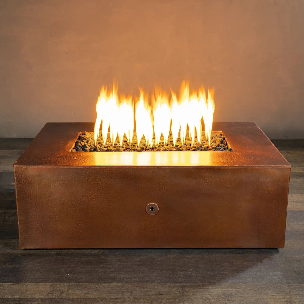 Luxury outdoor fire pit by Starfire Designs, featuring the Moreno rectangular fire pit in copper finish, measuring 48 inches by 32 inches, perfect for modern outdoor spaces. This natural gas fire pit creates a stunning flame display, ideal for enhancing backyard ambiance