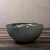 Graphite Starfire Designs Rustic 36-inch round concrete gravity gas fire pit showing the burner area without flames
