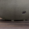 Close-up of the base and valve of the Starfire Designs Rustic 36-inch Round Concrete Gravity Gas Fire Pit in Natural Gray