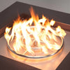 Round stainless steel gas burner producing bright, even flames within a fire pit, showcasing efficient gas flow and high-quality flame distribution for outdoor heating