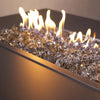  A detailed view of 1/2" Broken Fire Glass in Bronze Reflective, catching firelight with a shimmering glow. Enhances any propane or natural gas fire pit.