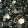 Detailed close-up of Starfire Glass 1/2" Broken Fire Glass in Gray Reflective finish, showing subtle gray tones with reflective highlights. This fire glass adds a modern, neutral aesthetic to fire pits and complements a variety of outdoor designs.