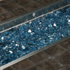 A close-up of Starfire Glass 1/2" Broken Fire Glass (10lbs) in Pacific Blue Reflective showcased in a stainless steel fire pit tray. The brilliant blue reflective glass intensifies the fire’s glow, creating a captivating effect. Perfect for modern gas fire pits, linear fire tables, and outdoor fireplaces, this durable fire glass ensures long-lasting performance and a stunning display.