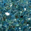 A detailed close-up of Starfire Glass 1/2" Broken Pre-Mixed Fire Glass in Caribbean Blue, featuring a vibrant mix of deep blue and sea-green reflective fire glass. Ideal for modern outdoor fire pits, propane fire tables, and backyard fireplaces, this heat-resistant glass creates a stunning coastal-inspired fire feature.