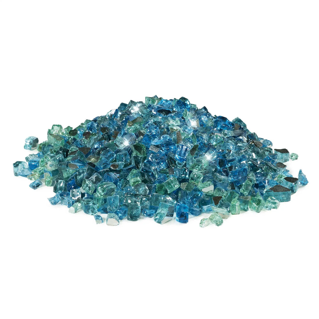 A mound of Starfire Glass 1/2" Broken Pre-Mixed Fire Glass in Caribbean Blue, with a radiant mix of turquoise, blue, and clear glass pieces. Designed for fire pits, outdoor fireplaces, and gas fire tables, this reflective glass enhances flame movement and adds a luxurious backyard fire feature.