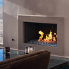 A sleek, built-in modern indoor gas fireplace featuring Starfire Glass 1/2" Broken Pre-Mixed Fire Glass (10lbs). The blue-toned reflective fire glass shimmers under the dancing flames, adding elegance to the contemporary living room. Ideal for fireplace inserts, natural gas fireplaces, and high-end fire pits.