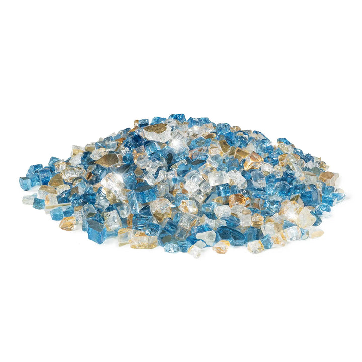 A loose pile of Starfire Glass 1/2" Broken Pre-Mixed Fire Glass in Pacific Sky, displaying a stunning blend of sky blue, clear, and gold-tinged glass pieces. Designed to withstand high temperatures, this fire glass enhances gas fire pits, fireplaces, and outdoor fire tables, providing a vibrant flame reflection.