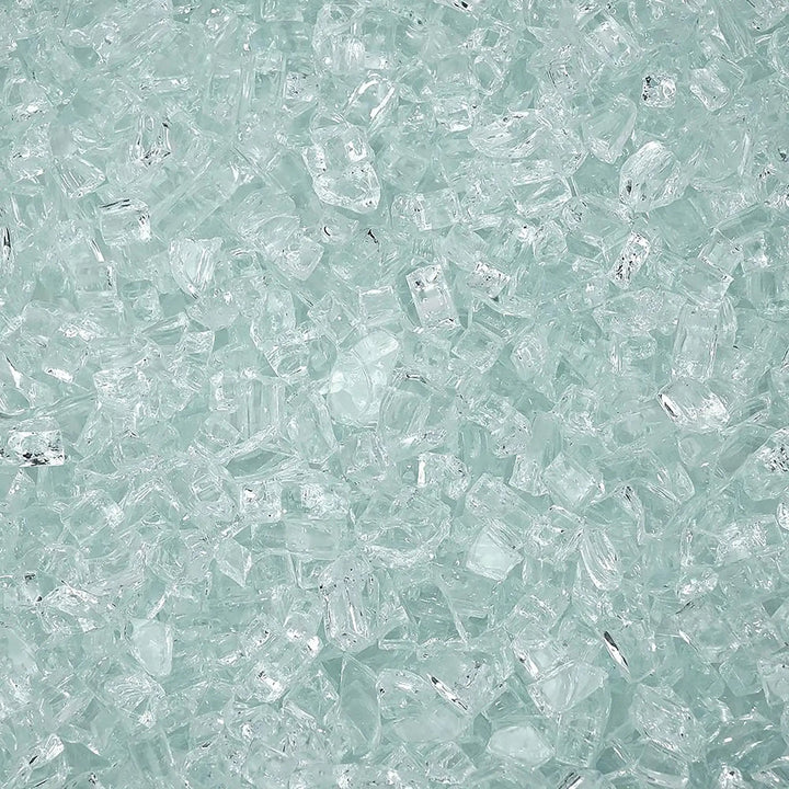 A close-up of Starfire Glass 1/4" Broken Fire Glass in Clear Reflective, showcasing its pure transparency and shimmering mirrored finish. Perfect for contemporary outdoor fire pits, gas fire tables, or fire bowls, it adds a clean, minimalist style with outstanding heat resistance.

