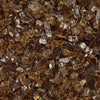 Close-up of Starfire Glass 1/4" Broken Fire Glass in Copper Reflective. The rich copper tones and reflective finish offer a warm and sophisticated accent for outdoor fire pits, gas fire tables, and fire bowls. Designed for durability and heat efficiency.