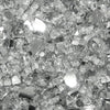 Close-up of Starfire Glass 1/4-inch broken fire glass in clear color, showcasing the reflective surface and smooth edges. Ideal for enhancing natural gas fire pits and propane fire tables with a sparkling aesthetic."