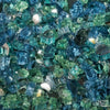 A close-up view of Starfire Glass 1/4" Broken Pre-Mixed Fire Glass (10lbs) in Caribbean Blue, featuring a vibrant mix of deep blue, teal, and clear fire glass. Ideal for gas fire pits, outdoor fireplaces, and patio fire features, this high-quality tempered fire glass adds a coastal-inspired ambiance with radiant light reflection.