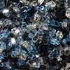 A close-up of Starfire Glass 1/4" Broken Pre-Mixed Fire Glass (10lbs) in Ocean Deep, featuring an exquisite mix of deep navy blue, turquoise, and clear glass pieces. Ideal for modern outdoor fire pits, luxury gas fireplaces, and contemporary fire tables, this premium mix enhances ambiance with a striking shimmer.