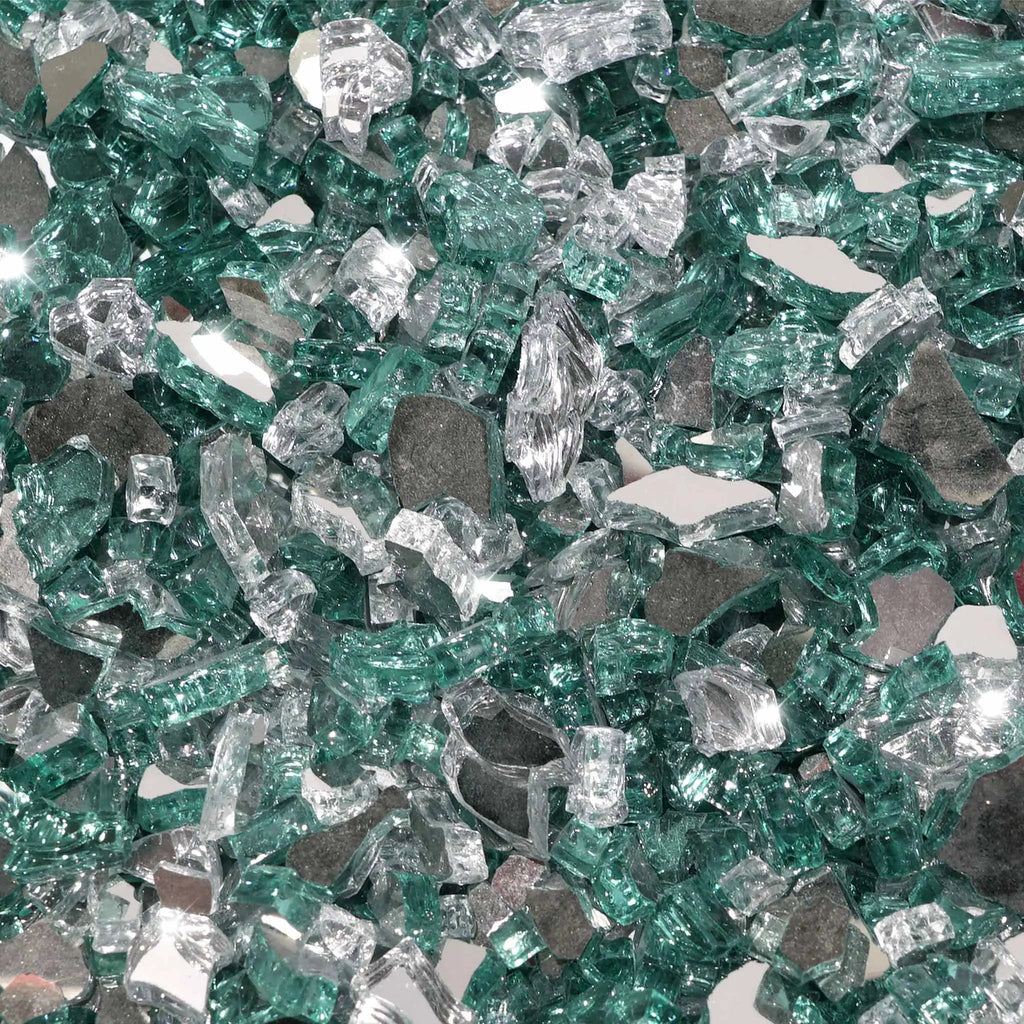 A close-up of Starfire Glass 1/4" Broken Pre-Mixed Fire Glass (10lbs) in Water On Ice, with a mix of aqua blue, icy clear, and silver reflective pieces. Designed for high-end fire tables, natural gas fire pits, and outdoor fireplaces, this glass offers a cool-toned, mesmerizing shimmer when flames pass through.