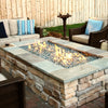A modern built-in gas fireplace featuring Starfire Glass 1/4" Broken Pre-Mixed Fire Glass (10lbs) in blue and clear hues, offering a sleek, contemporary look. The reflective fire glass enhances the dancing flames, creating a warm, inviting ambiance in a minimalist living space. Designed for indoor gas fireplaces, this premium fire pit glass is heat-resistant and long-lasting, making it a perfect choice for luxury gas fireplaces.