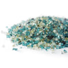A bright and refreshing combination of sky blue, clear, and golden fire glass in the Starfire Glass 1/4" Broken Pre-Mixed Fire Glass in Pacific Sky (10lbs). This fire pit glass is perfect for coastal outdoor fire tables, patio fire bowls, and high-end gas fire pits, delivering a vibrant and clean aesthetic.