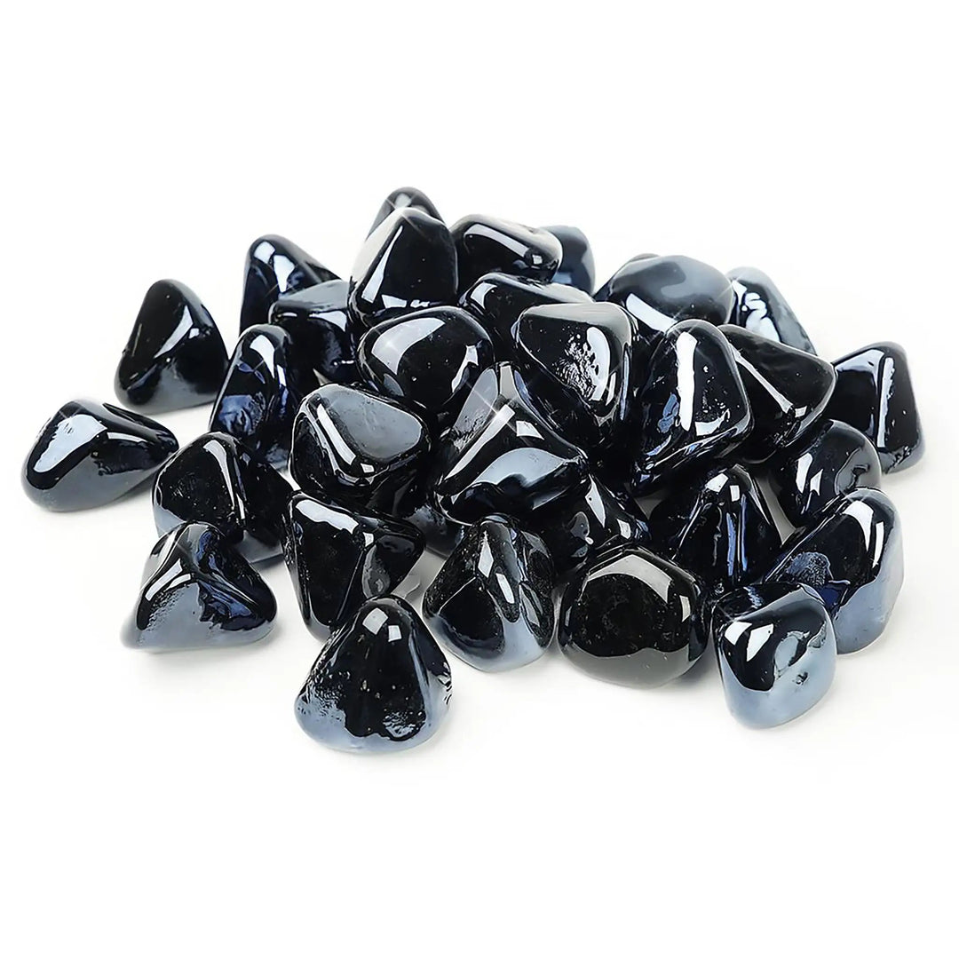 A collection of Starfire Glass Reflective Fire Diamonds in Black, designed for fire pits and fireplaces. These heat-resistant, highly reflective fire glass diamonds create a striking contrast, offering a bold and modern look for gas fire bowls and outdoor fire features.