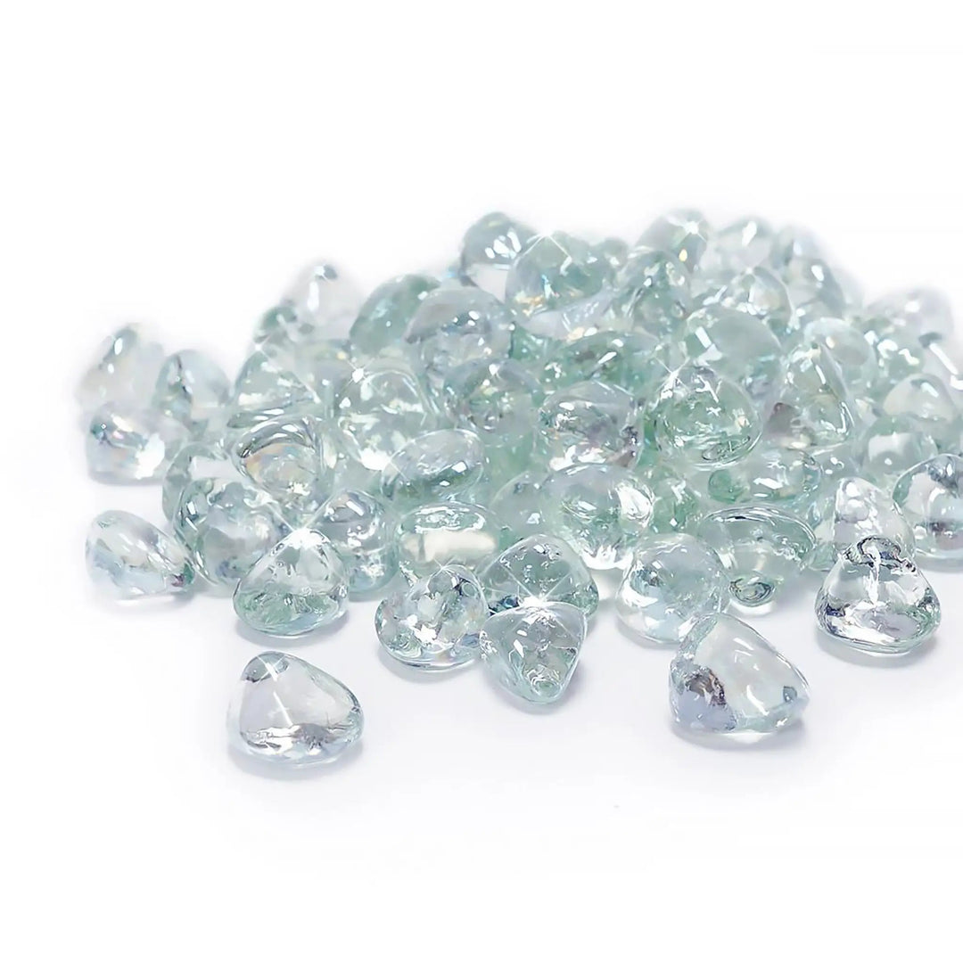 A pristine collection of Starfire Glass Reflective Fire Diamonds in Clear, featuring a high-gloss, heat-resistant design. These fire pit glass diamonds reflect light beautifully, creating a bright, elegant ambiance in modern outdoor fire pits and commercial fire bowls.