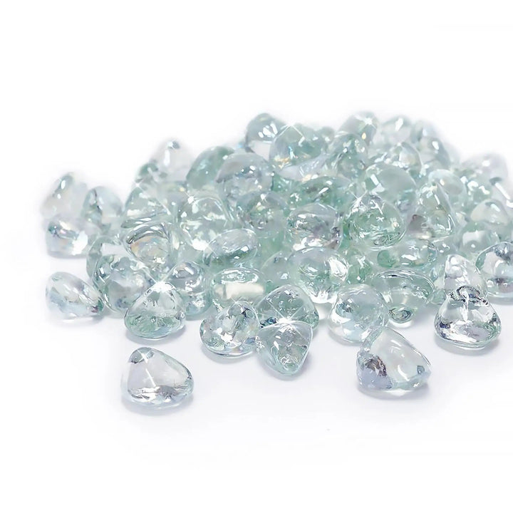 A pristine collection of Starfire Glass Reflective Fire Diamonds in Clear, featuring a high-gloss, heat-resistant design. These fire pit glass diamonds reflect light beautifully, creating a bright, elegant ambiance in modern outdoor fire pits and commercial fire bowls.