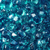 High-resolution close-up of Starfire Glass Reflective Fire Diamonds in Azuria blue, showcasing their smooth, polished surface with a shimmering reflective coating. These fire glass gems add a vibrant blue glow to any outdoor fire pit or fireplace, enhancing the ambiance with their striking appearance.