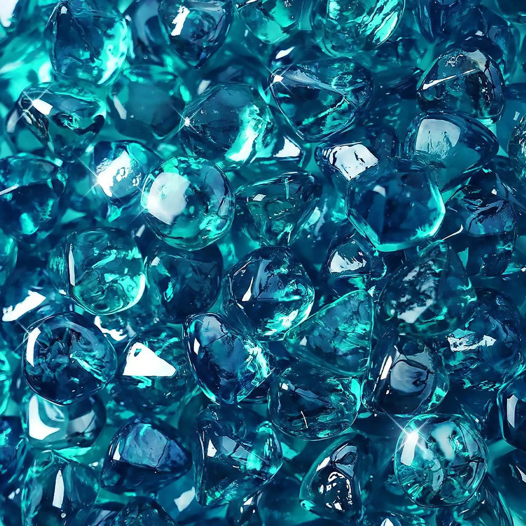 High-resolution close-up of Starfire Glass Reflective Fire Diamonds in Azuria blue, showcasing their smooth, polished surface with a shimmering reflective coating. These fire glass gems add a vibrant blue glow to any outdoor fire pit or fireplace, enhancing the ambiance with their striking appearance.