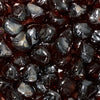 Close-up of Starfire Glass Reflective Fire Diamonds in copper brown, displaying a brilliant, high-gloss finish. These fire pit glass stones create a warm, inviting ambiance, perfect for outdoor spaces with gas fire pits or fire tables.