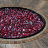 A bold and luxurious round gas fire pit filled with deep red Starfire Glass Reflective Fire Drops, creating a stunning contrast with the dark fire pan. The premium fire pit glass adds elegance and high heat resistance, ideal for an outdoor patio fire pit or gas fire bowls outdoor setup
