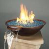 Taza Moreno 30-inch round copper fire and water bowl with blue fire glass, cascading water feature, and vibrant flames, a luxurious outdoor fire pit for modern backyards by Starfire Designs