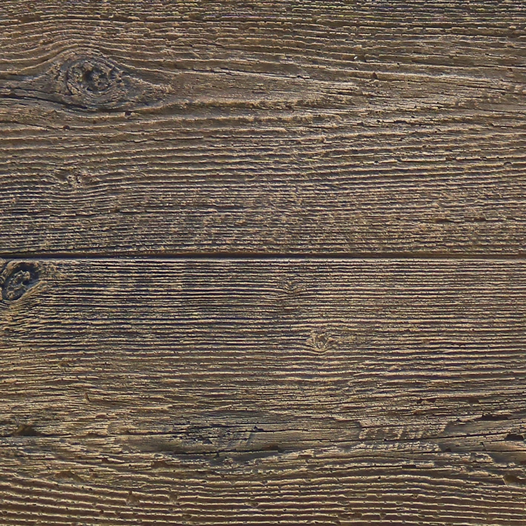  A close-up view of the wood grain texture on the Outdoor Plus 108" Catalina Gas Fire Pit in Oak finish. The image shows a highly detailed and realistic wood-like surface crafted from durable concrete. Ideal for outdoor patios and gardens, this fire pit combines the rustic appearance of wood with the long-lasting strength of concrete, adding both functionality and a natural aesthetic to any outdoor space