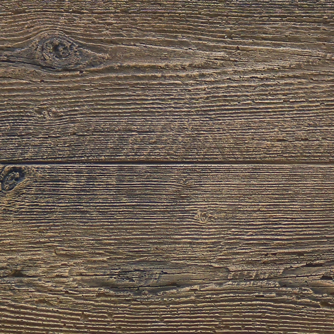 Close-up of The Outdoor Plus 108" Coronado wood grain concrete gas fire pit in Oak, highlighting the realistic wood grain texture molded into the concrete surface. This detailed texture mimics aged wood, giving the fire pit a rustic and natural aesthetic while maintaining the durability and strength of concrete. The perfect addition to outdoor spaces seeking a blend of modern functionality and rustic charm.