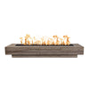 The Outdoor Plus 108" Coronado wood grain concrete gas fire pit in Oak, showcasing its modern design with rustic wood grain details. This rectangular fire pit features a long burner tray filled with lava rocks, with flames dancing above. Ideal for large outdoor spaces, patios, and commercial settings, offering both warmth and style. Made from durable concrete for long-lasting performance and weather resistance. Perfect for entertaining guests in any outdoor living area.