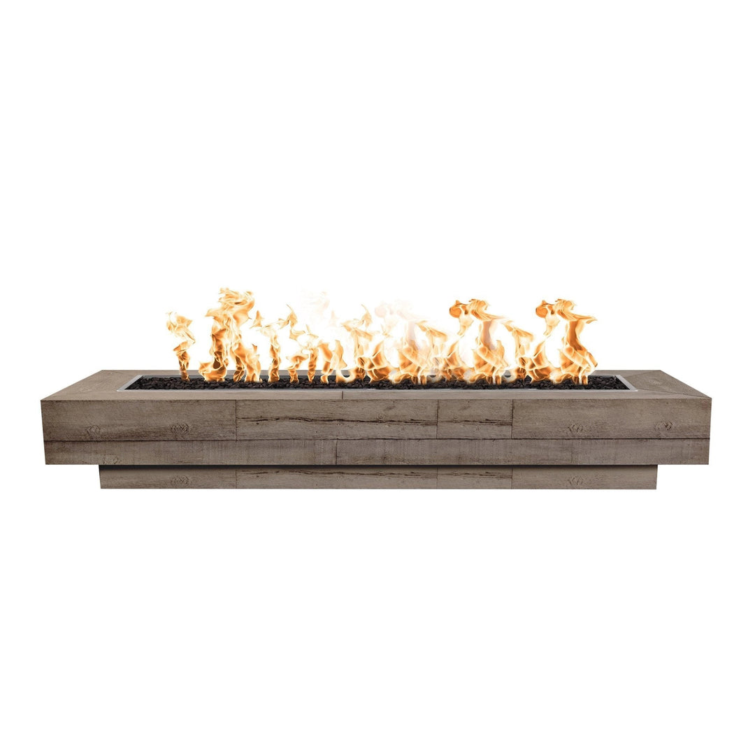 The Outdoor Plus 108" Coronado wood grain concrete gas fire pit in Oak, showcasing its modern design with rustic wood grain details. This rectangular fire pit features a long burner tray filled with lava rocks, with flames dancing above. Ideal for large outdoor spaces, patios, and commercial settings, offering both warmth and style. Made from durable concrete for long-lasting performance and weather resistance. Perfect for entertaining guests in any outdoor living area.