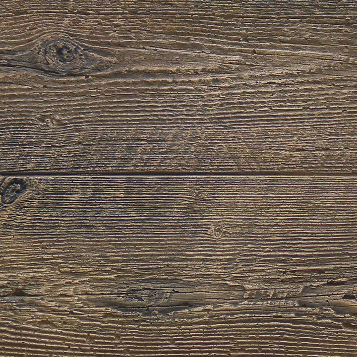 Close-up view of the realistic wood grain texture on The Outdoor Plus 120-inch Coronado Wood Grain Concrete Gas Fire Pit in Oak finish. The detailed texture mimics the appearance of real oak wood, enhancing the fire pit's rustic charm while being constructed from durable concrete. This texture adds a unique natural element to any outdoor space