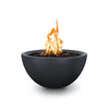 Full view of The Outdoor Plus 30-inch Luna Concrete Gas Fire Pit in Slate, featuring a sleek, dark concrete bowl design. The fire pit emits a beautiful flame atop a bed of black lava rocks, creating an inviting focal point for any patio or backyard. With its modern design and durable construction, this fire pit is perfect for enhancing outdoor living spaces, providing warmth and ambiance. Ideal for use with natural gas or propane, making it a versatile option for residential and commercial environments