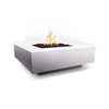 The Outdoor Plus 36" Cabo Square Concrete Gas Fire Pit in Pearl, offering a refined and minimalist aesthetic. The smooth concrete construction in a pearl finish brings a soft, neutral tone to any outdoor space. The recessed burner is surrounded by black lava rocks, perfect for creating a welcoming ambiance on patios or outdoor seating areas