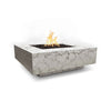 The Outdoor Plus 36" Cabo Square Concrete Gas Fire Pit in Rustic White finish. The textured white concrete gives the fire pit an antique, weathered look, perfect for blending into rustic or farmhouse-style outdoor spaces. The fire pit includes a recessed burner filled with black lava rock, creating a striking contrast against the light finish.
