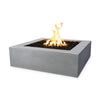 The Outdoor Plus 36" Quad Concrete Gas Fire Pit in natural gray, featuring a minimalist square design with a large fire opening. The natural gray concrete finish provides a sleek, modern look while being weather-resistant and durable for outdoor use. This fire pit is perfect for contemporary patio or garden spaces.