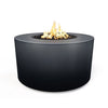 The Outdoor Plus 42" Chat Height Florence Concrete Gas Fire Pit in slate has a rough, textured finish that adds a rugged, natural element to outdoor spaces. Its dark gray tone complements a variety of outdoor aesthetics, perfect for both modern and rustic environments.