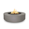 The Outdoor Plus 42" Occasional Height Florence Gas Fire Pit in a natural gray finish. This contemporary gas fire pit has a round shape and a smooth surface, complementing modern outdoor decor. Built from premium concrete, it is perfect for enhancing patios, gardens, and outdoor lounges. Its gas-powered flame offers cozy warmth and an inviting atmosphere.