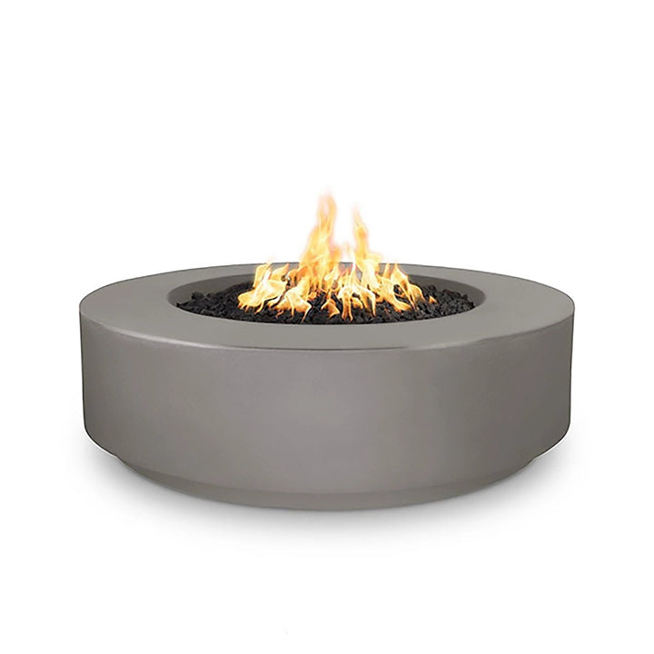 The Outdoor Plus 42" Occasional Height Florence Gas Fire Pit in a natural gray finish. This contemporary gas fire pit has a round shape and a smooth surface, complementing modern outdoor decor. Built from premium concrete, it is perfect for enhancing patios, gardens, and outdoor lounges. Its gas-powered flame offers cozy warmth and an inviting atmosphere.