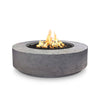 The Outdoor Plus 42" Occasional Height Florence Gas Fire Pit in Rustic Gray with a textured concrete finish. This round fire pit brings a natural, rugged look to outdoor living areas, while offering the convenience of gas heating. Designed for durability, it is ideal for contemporary or rustic-inspired patios and decks. 